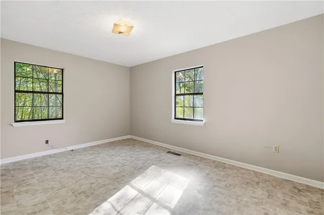 an empty room with windows