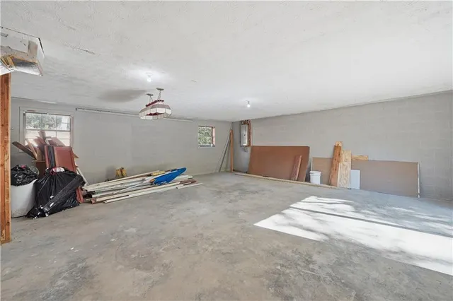 a bedroom with bed and cabinets