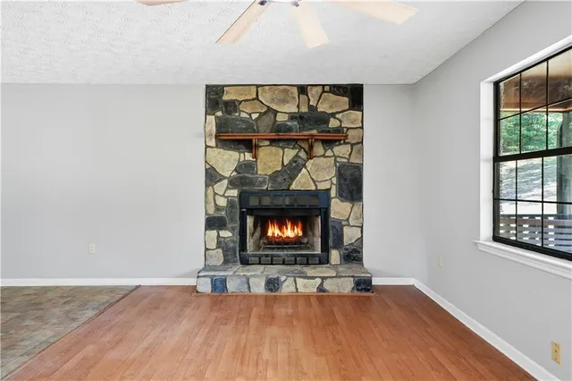a view of room with window and fireplace