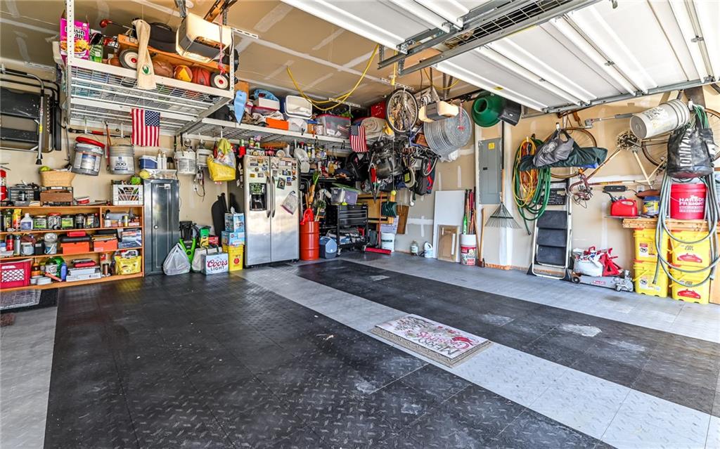 150 Independence Way Sewickley, PA 15143 - Photo 30 of 42 Your Garage Storage Space is Maximized by the Custom Hanging Racks and Interlocking Hard Plastic Tiles to protect the Concrete Floor
