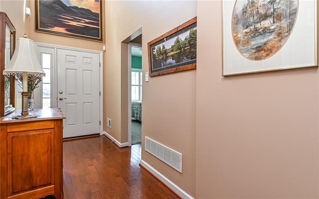 150 Independence Way Sewickley, PA 15143 - Photo 3 of 42 The Two Story Entry is illuminated by Natural Light from the windows above and beside the Front Door ~ Walls providing the "canvas" for your Artwork ~ The Doorway on the right takes you to the 2nd BR and Guest Bathroom
