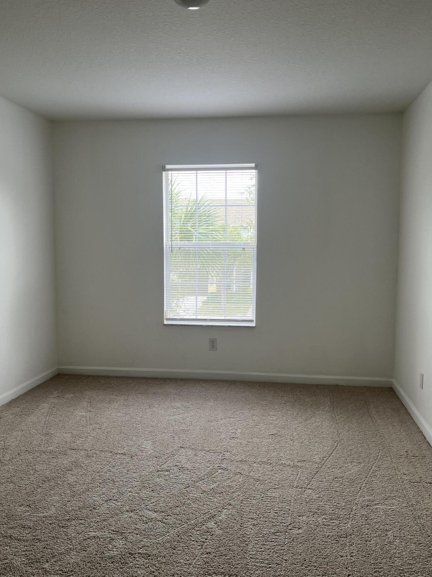 2785 Reston Street, Unit 102 Melbourne, FL 32935 - Photo 14 of 27 an empty room with a window