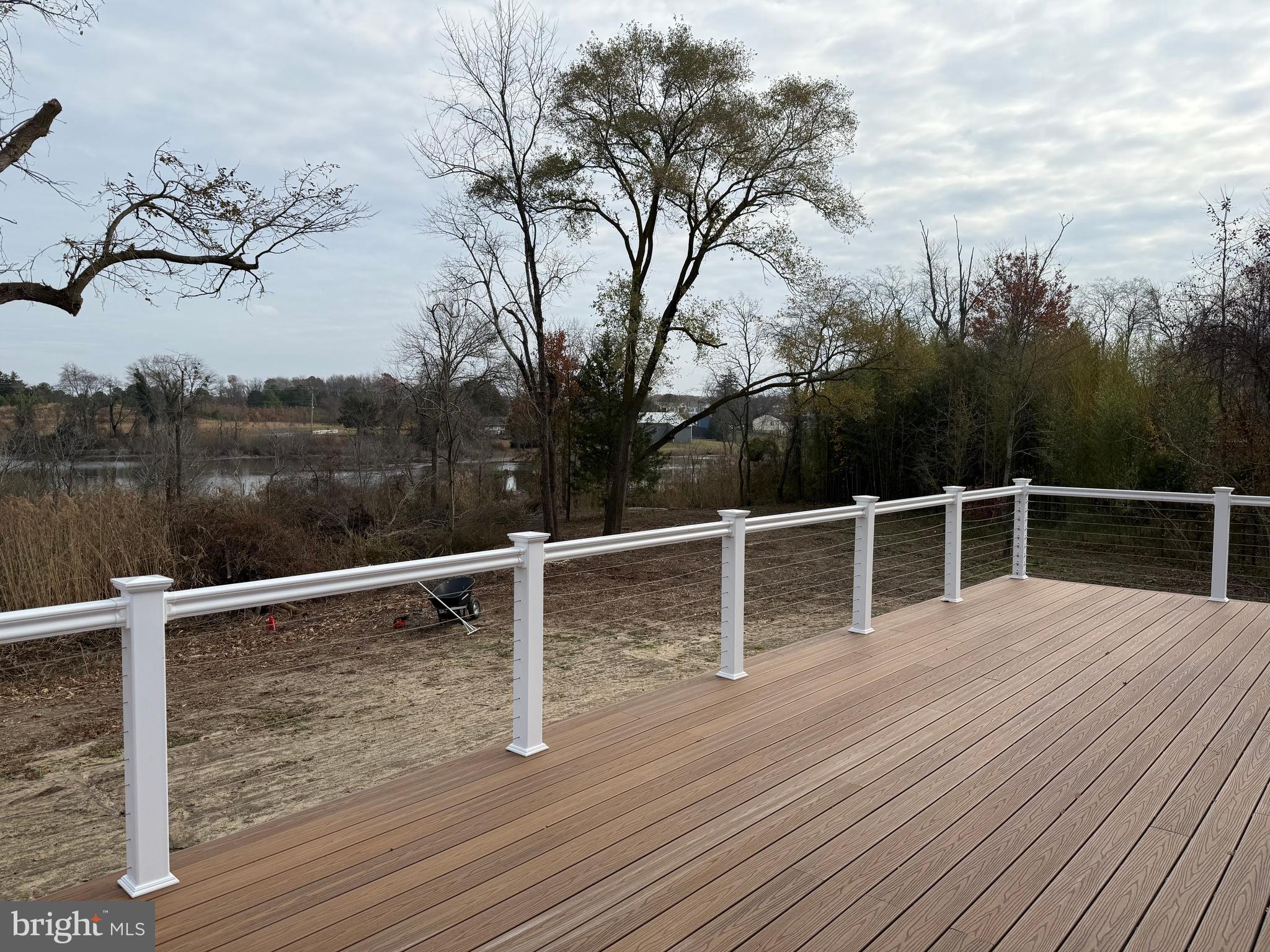 44 A Cedar Beach Road Milford, DE 19963 - Photo 14 of 15 a view of a roof deck with wooden floor and fence