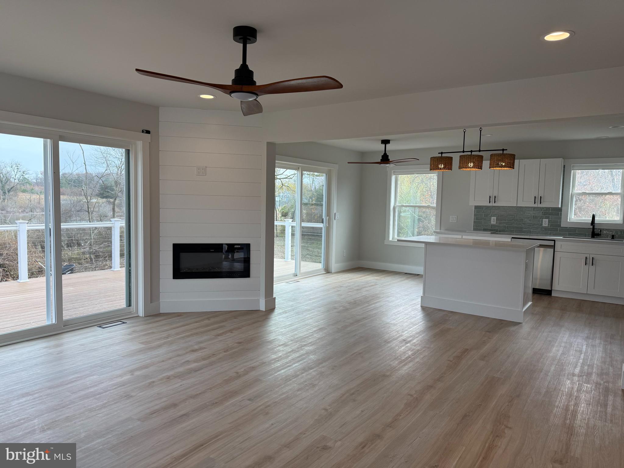 44 A Cedar Beach Road Milford, DE 19963 - Photo 3 of 15 a view of a kitchen with a sink wooden floor and a window