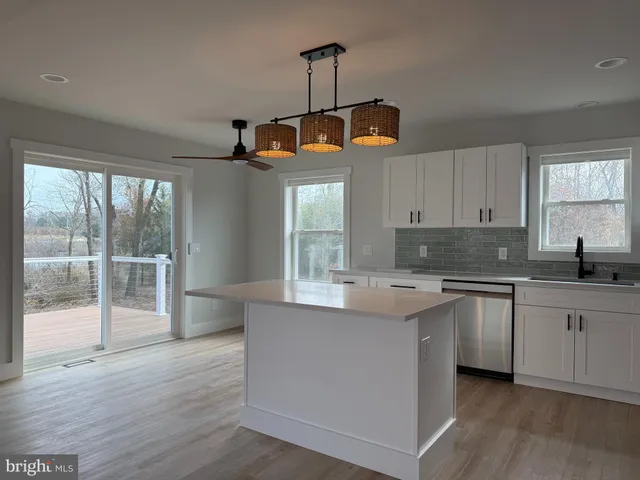 a kitchen with a sink and window