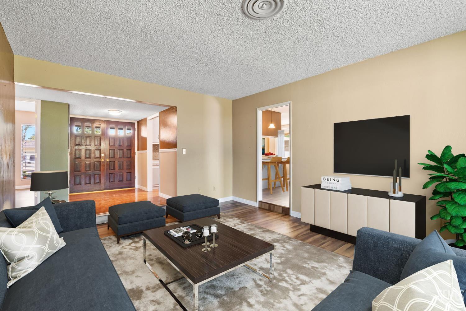 Undisclosed Address Bakersfield, CA 93309 - Photo 13 of 63 a living room with furniture and a flat screen tv