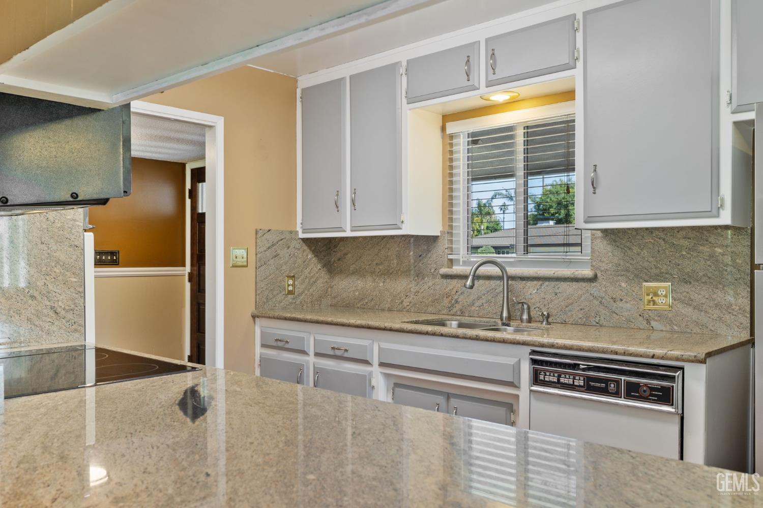 Undisclosed Address Bakersfield, CA 93309 - Photo 16 of 63 a kitchen with stainless steel appliances granite countertop a sink and a refrigerator