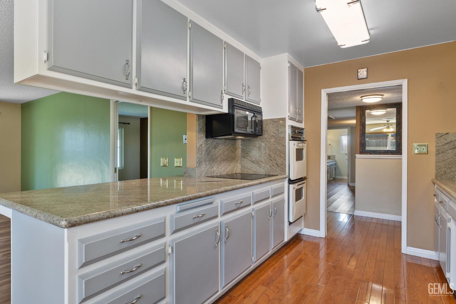 Undisclosed Address Bakersfield, CA 93309 - Photo 18 of 63 a kitchen with stainless steel appliances granite countertop a refrigerator and a sink