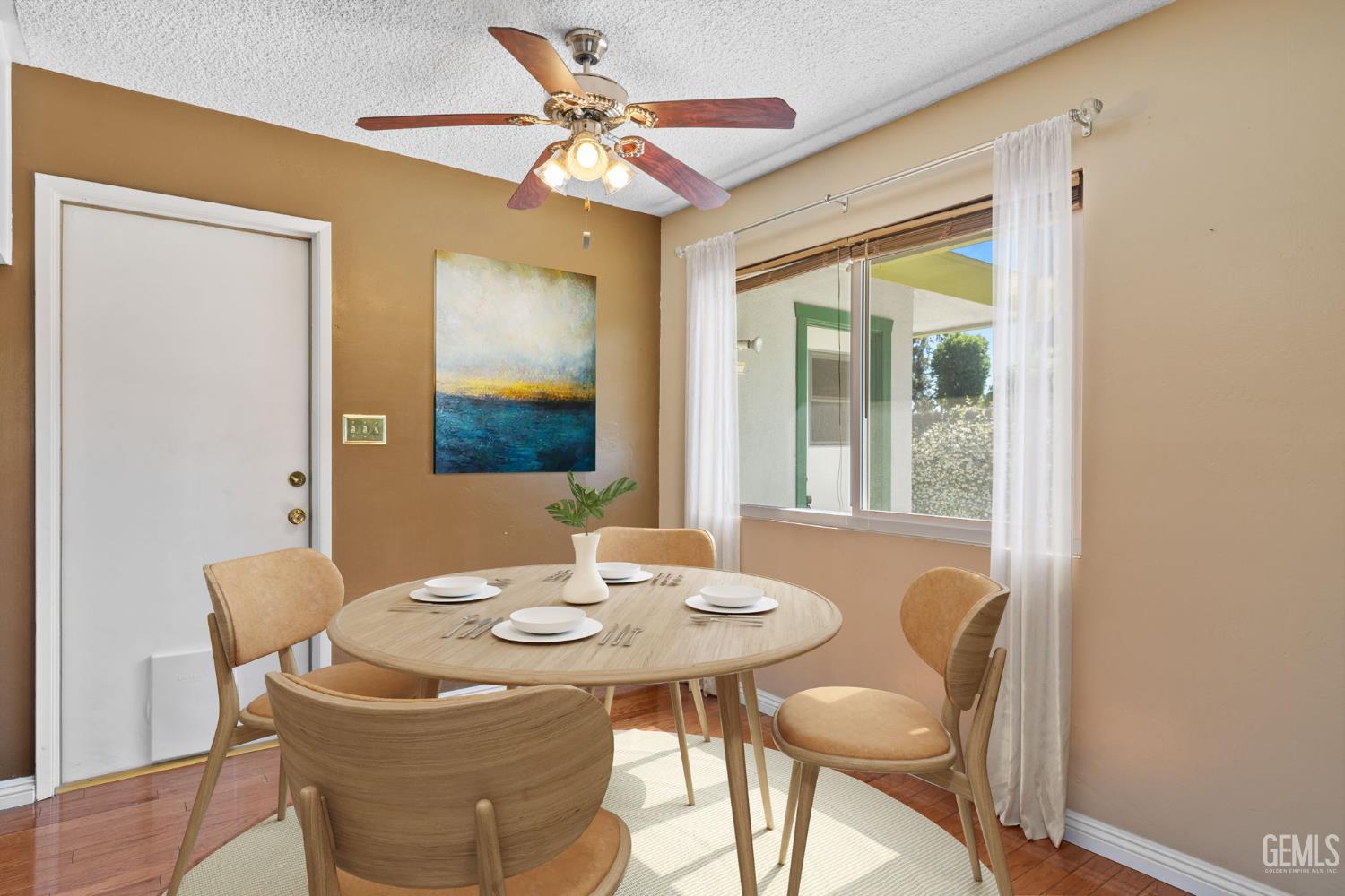 Undisclosed Address Bakersfield, CA 93309 - Photo 21 of 63 a dining room with a table and chairs