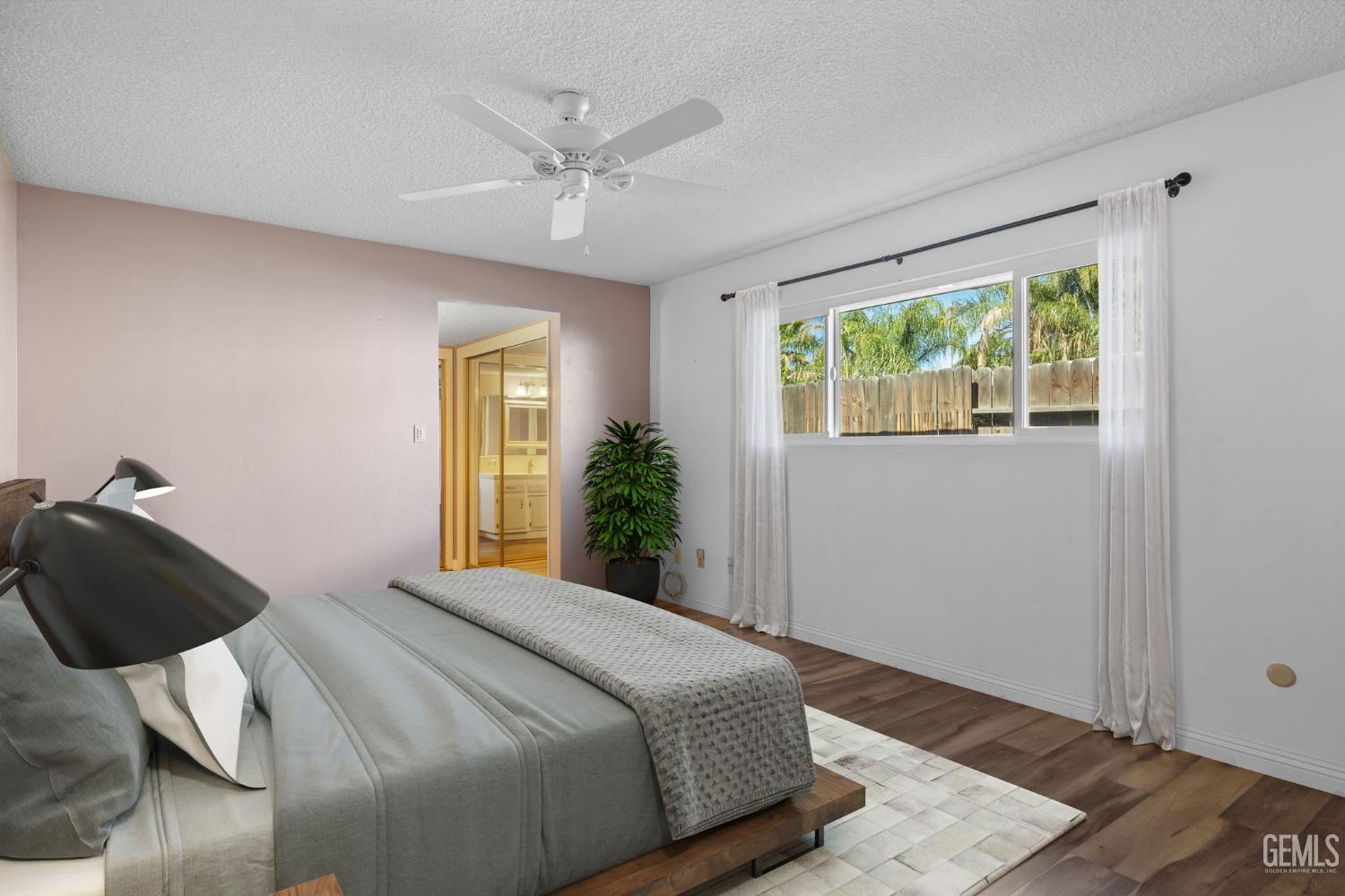 Undisclosed Address Bakersfield, CA 93309 - Photo 23 of 63 a bedroom with a bed and a window