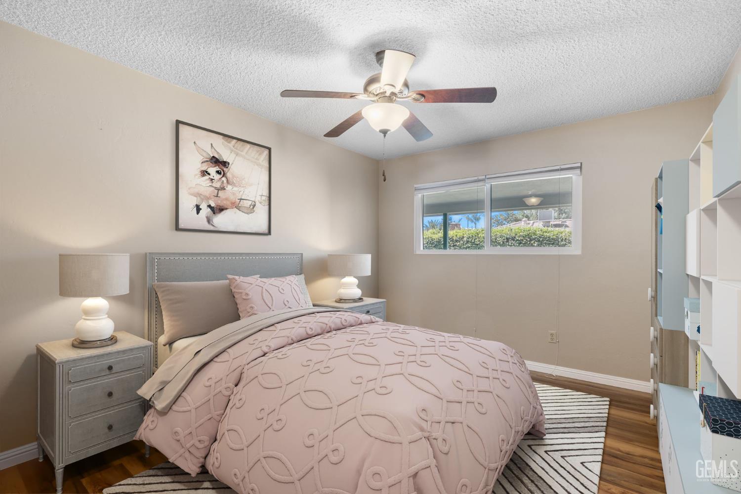 Undisclosed Address Bakersfield, CA 93309 - Photo 31 of 63 a bedroom with a bed and a painting on the wall