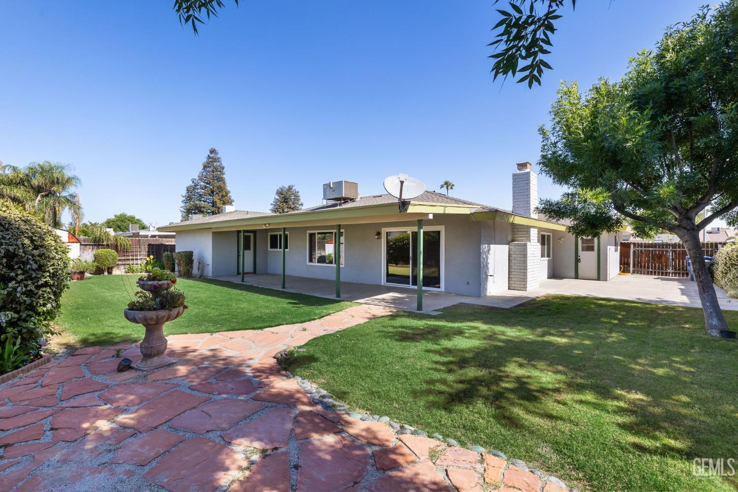 Undisclosed Address Bakersfield, CA 93309 - Photo 34 of 63 a front view of house with yard and green space