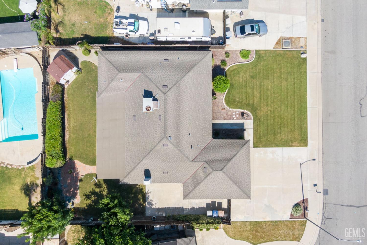 Undisclosed Address Bakersfield, CA 93309 - Photo 39 of 63 an aerial view of a house with swimming pool