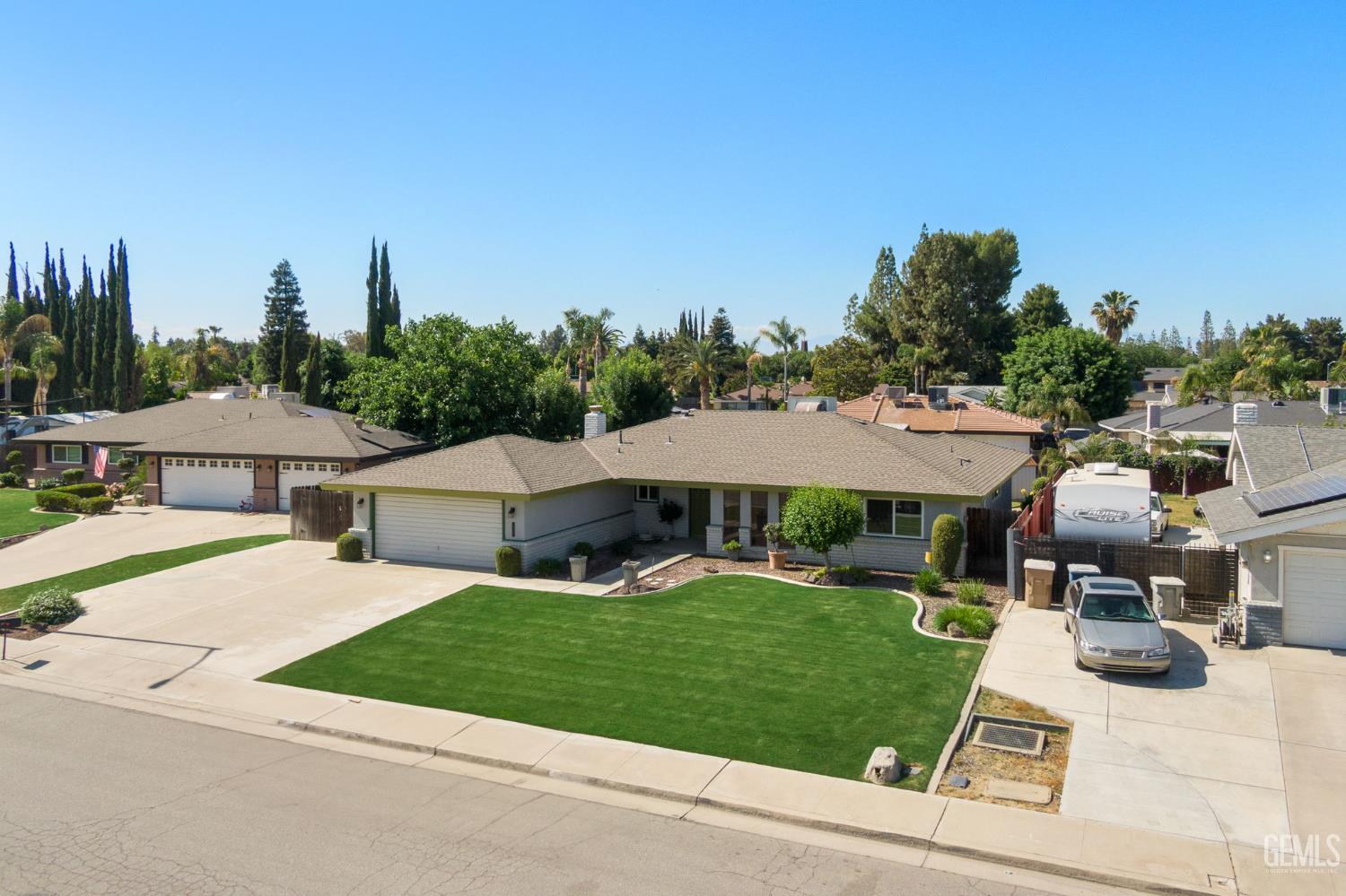 Undisclosed Address Bakersfield, CA 93309 - Photo 4 of 63 a view of house with yard and car parked