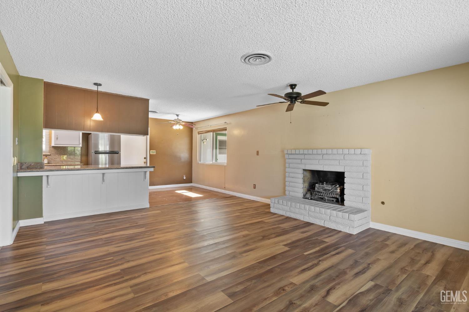Undisclosed Address Bakersfield, CA 93309 - Photo 47 of 63 a view of a kitchen cabinets and a fireplace