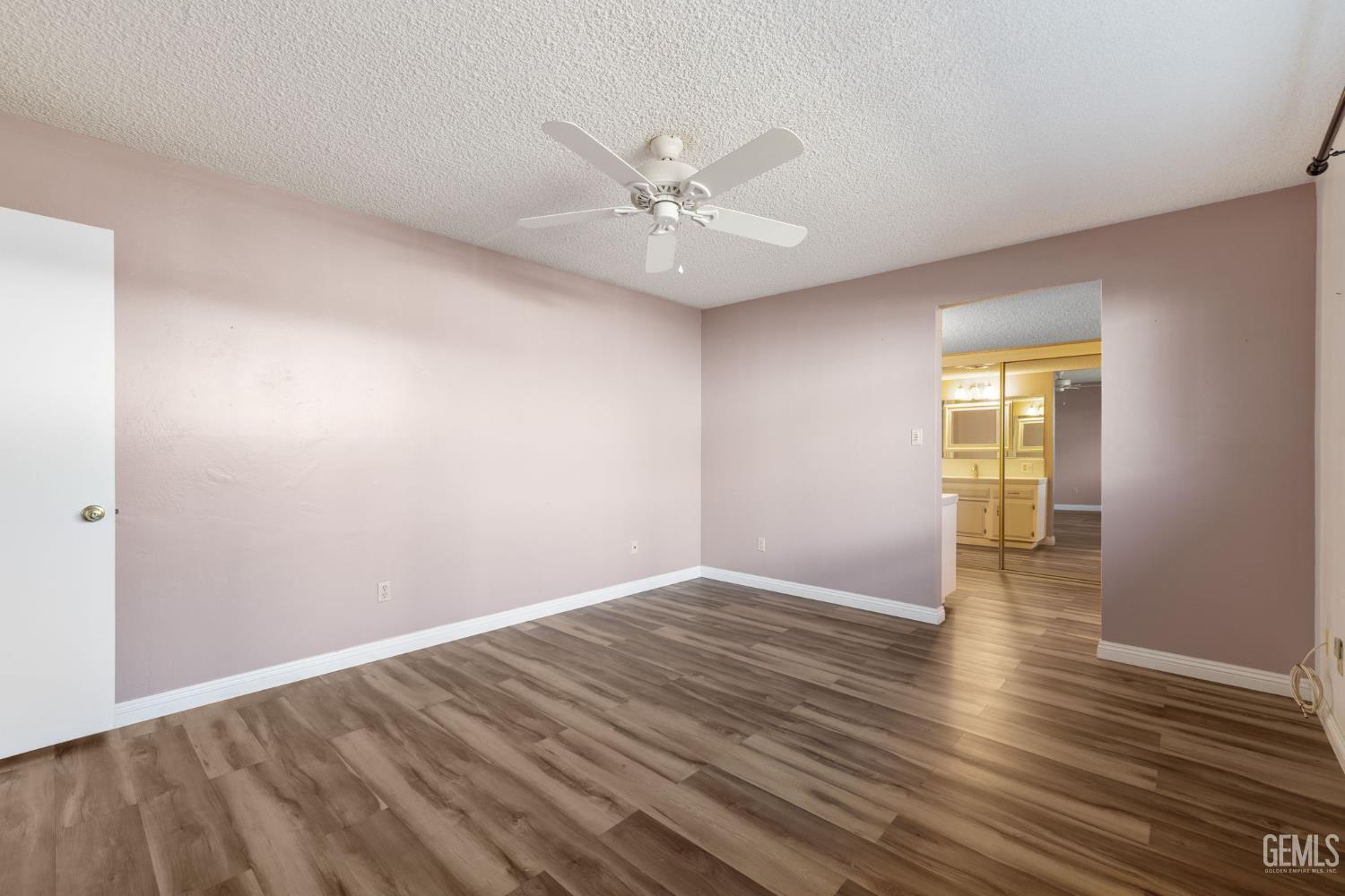 Undisclosed Address Bakersfield, CA 93309 - Photo 58 of 63 a view of an empty room with wooden floor and a window