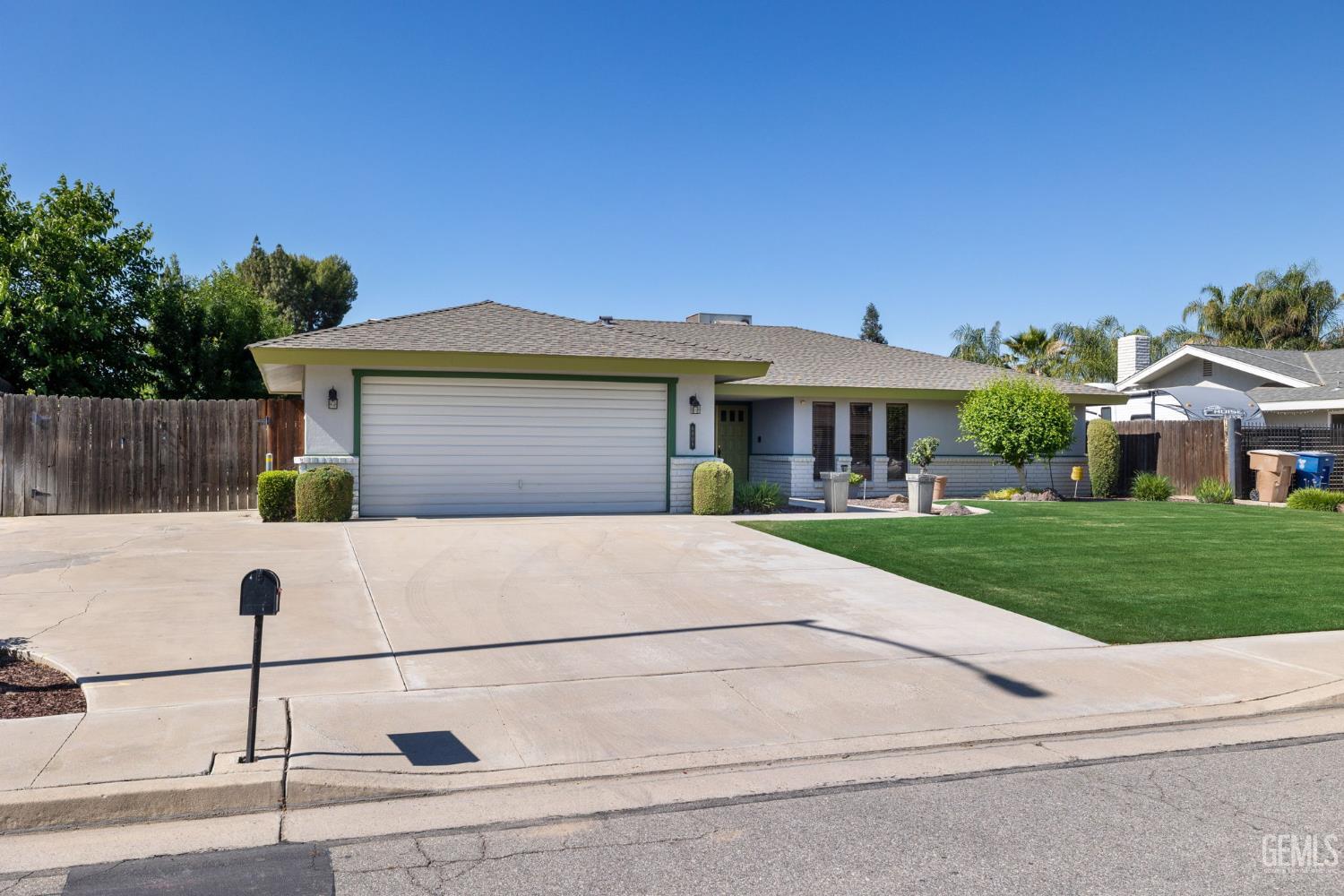 Undisclosed Address Bakersfield, CA 93309 - Photo 6 of 63 a front view of a house with a yard
