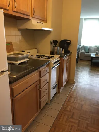 a kitchen with a stove and a sink