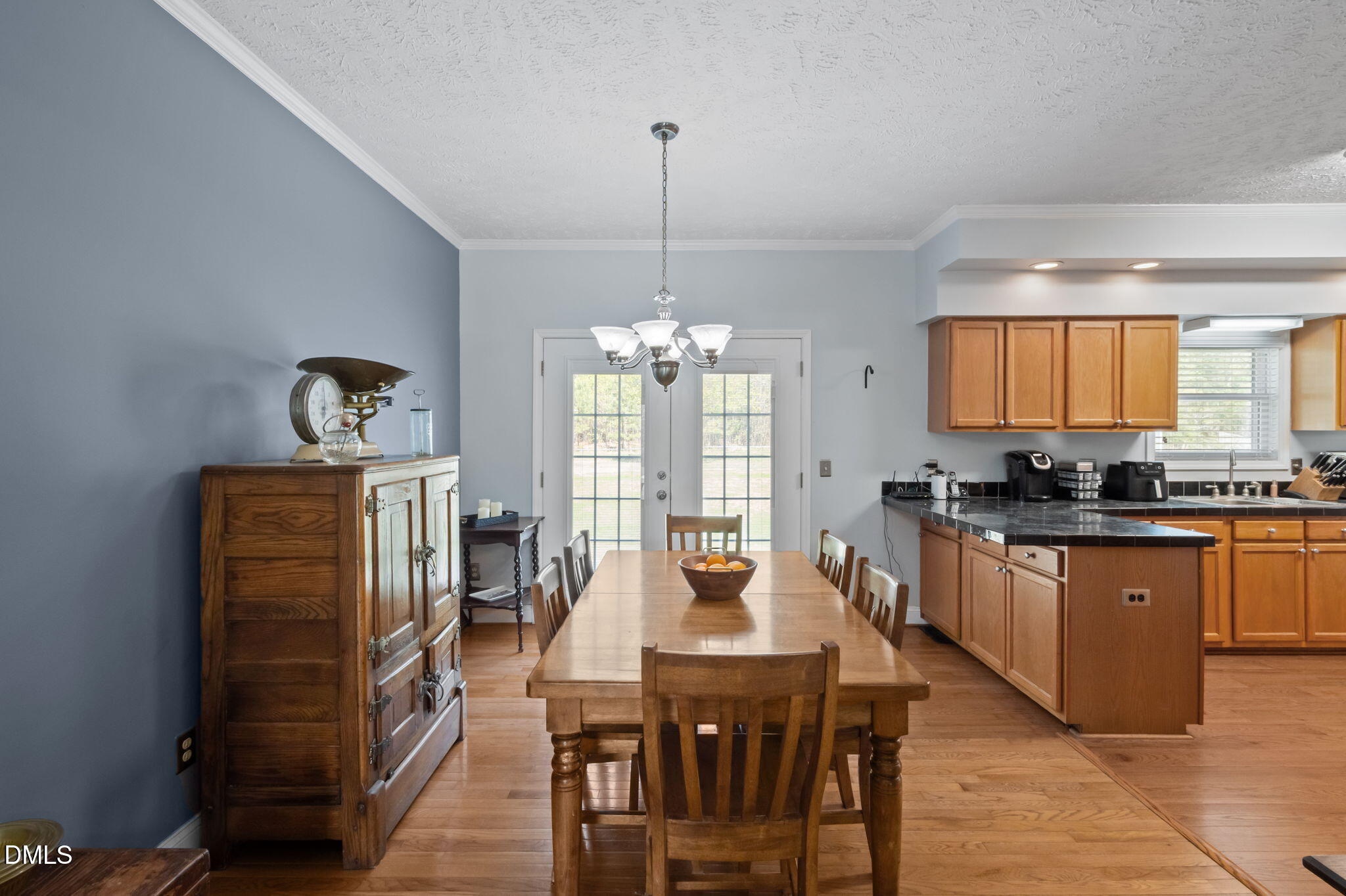 236 Dirgie Mine Road Roxboro, NC 27574 - Photo 25 of 55 a kitchen with stainless steel appliances granite countertop a dining table chairs stove a refrigerator and kitchen view