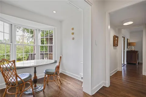 a living room with furniture and large windows
