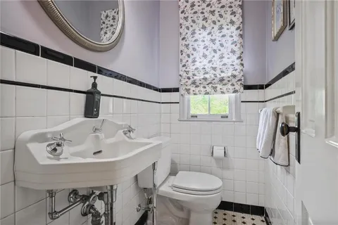 a living room with furniture a table and chairs