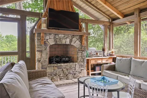 a bathroom with a granite countertop sink a light fixture and a mirror