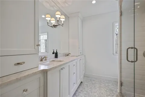 a bedroom with a bed and cabinets