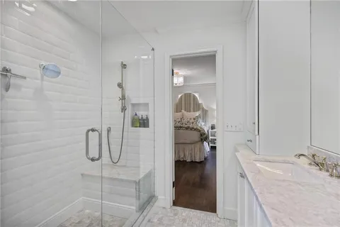 a bedroom with a bed and a couch