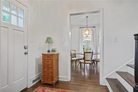 a dining room with furniture window wooden floor