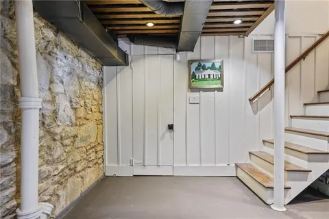 a view of a porch with furniture and next to ceiling window