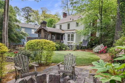 a view of outdoor sitting space with porch and garden