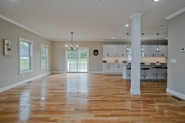 a view of kitchen with cabinets and wooden floor