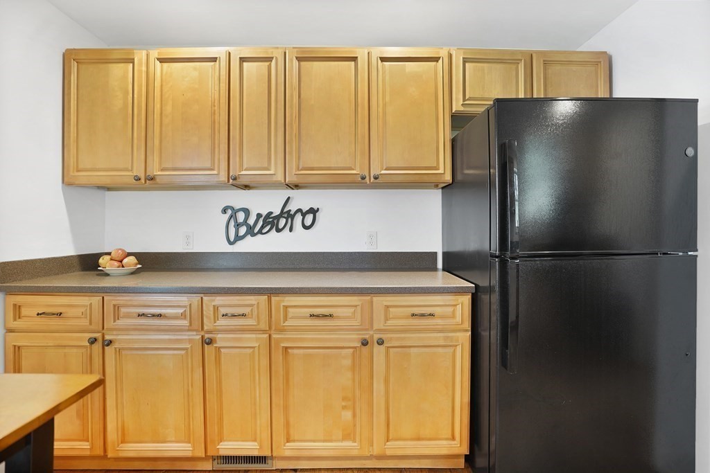 49 Marchioness Road Springfield, MA 01129 - Photo 11 of 35 a kitchen with stainless steel appliances granite countertop a refrigerator and a stove