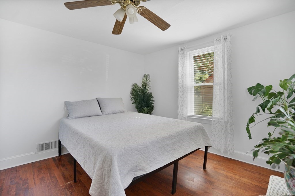 49 Marchioness Road Springfield, MA 01129 - Photo 15 of 35 a bedroom with a bed and a potted plant