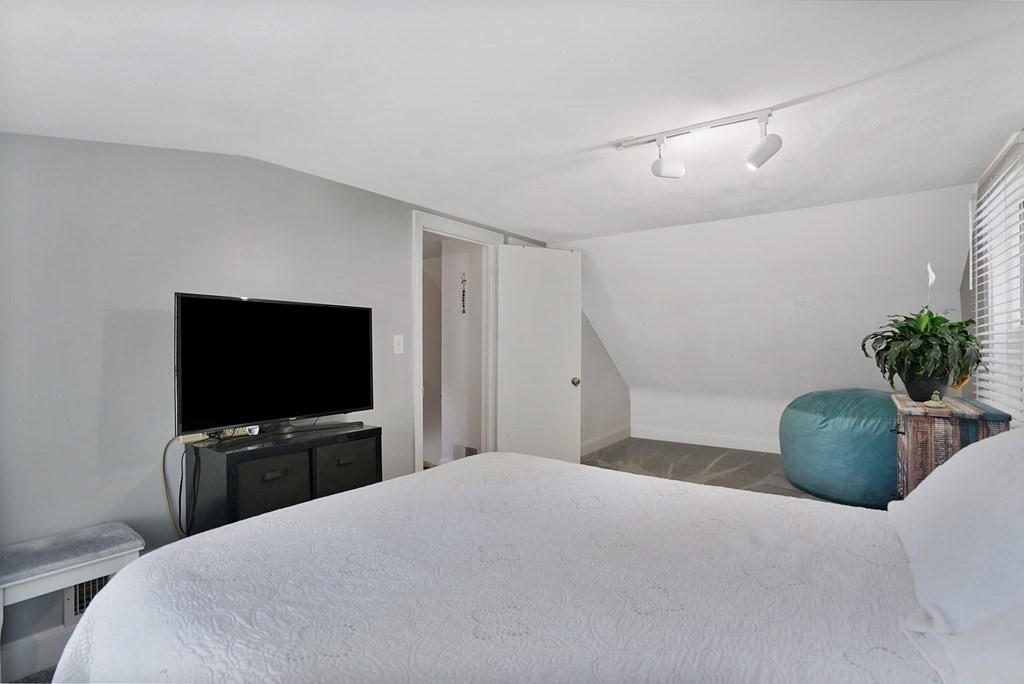 49 Marchioness Road Springfield, MA 01129 - Photo 21 of 35 a bedroom with a bed and a flat screen tv