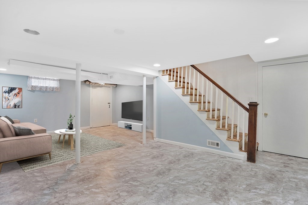 49 Marchioness Road Springfield, MA 01129 - Photo 22 of 35 a view of a livingroom with furniture and staircase