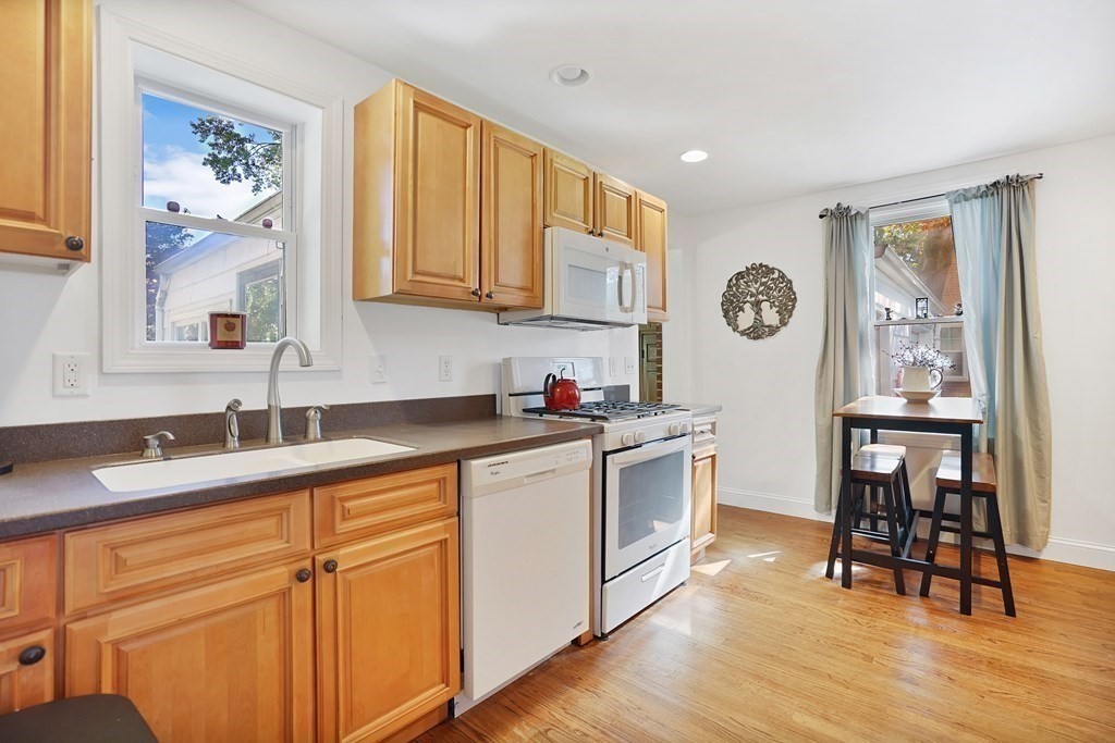 49 Marchioness Road Springfield, MA 01129 - Photo 8 of 35 a kitchen with a sink cabinets and wooden floor