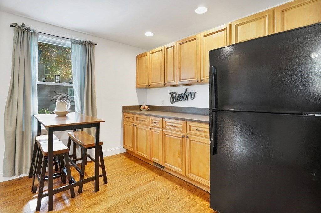 49 Marchioness Road Springfield, MA 01129 - Photo 9 of 35 a kitchen with stainless steel appliances granite countertop a refrigerator a sink and a stove with wooden floor