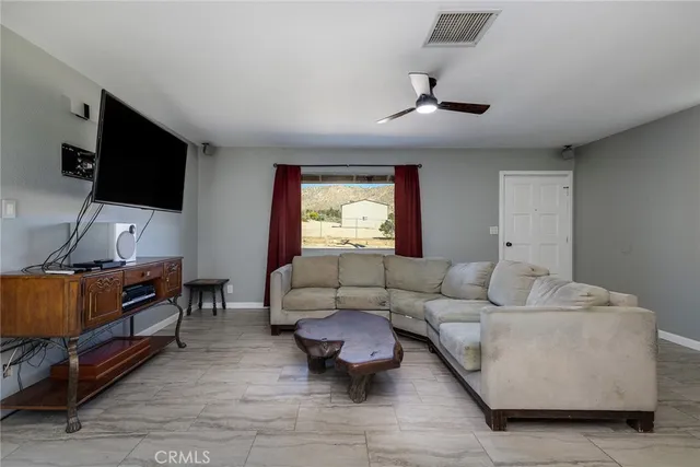a living room with furniture and a window