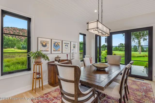 a view of a livingroom with furniture and a window