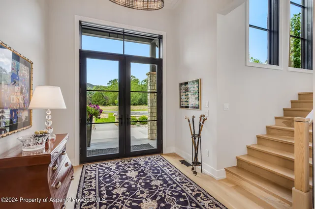 a living room with furniture and a rug