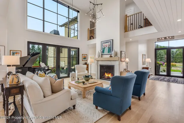 a bedroom with bed and windows