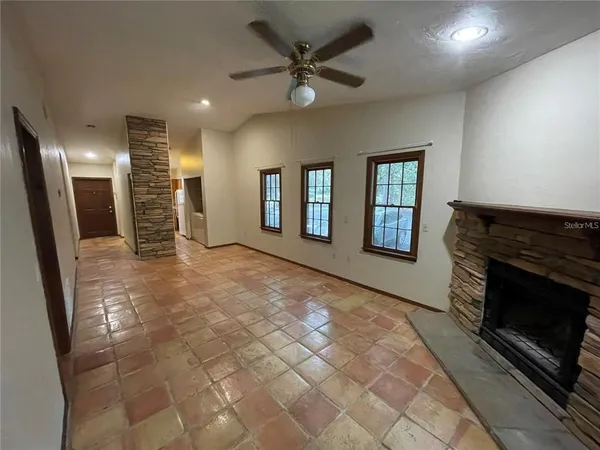 a kitchen with a refrigerator and a stove