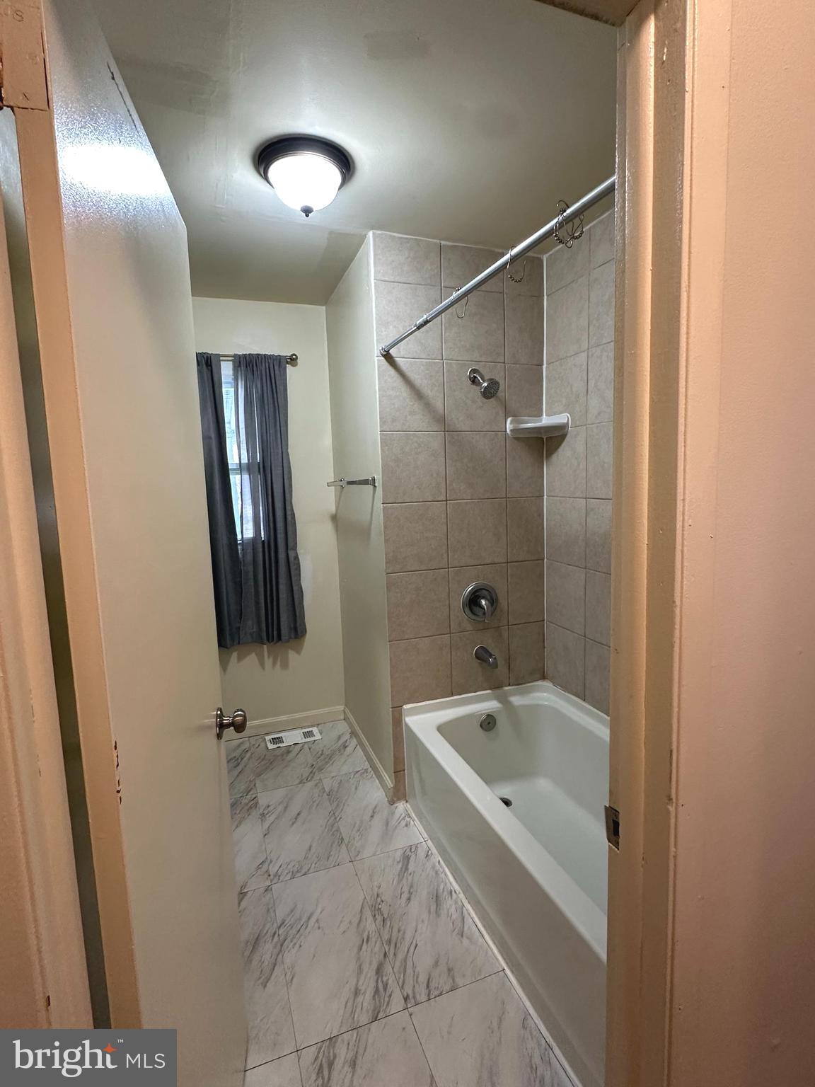 814 North Reymann Street Ranson, WV 25438 - Photo 12 of 19 a bathroom with a bathtub and shower