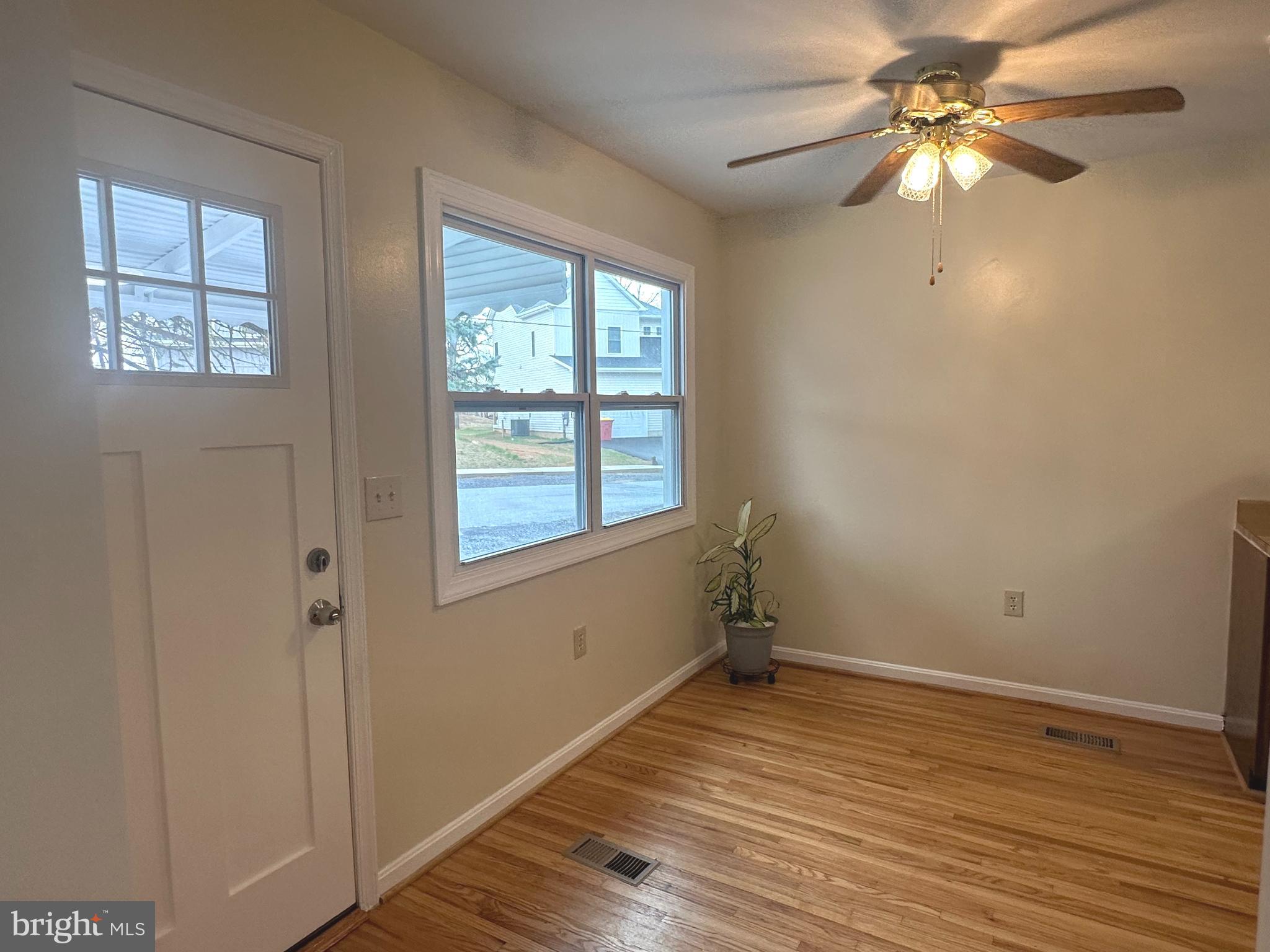 814 North Reymann Street Ranson, WV 25438 - Photo 2 of 19 a view of empty room with wooden floor and fan