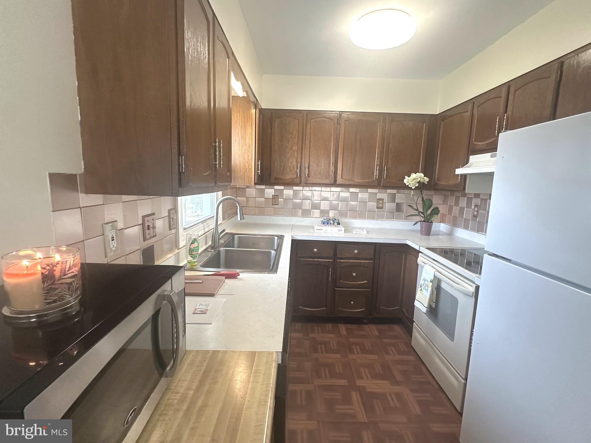 814 North Reymann Street Ranson, WV 25438 - Photo 3 of 19 a kitchen with a sink and a stove top oven