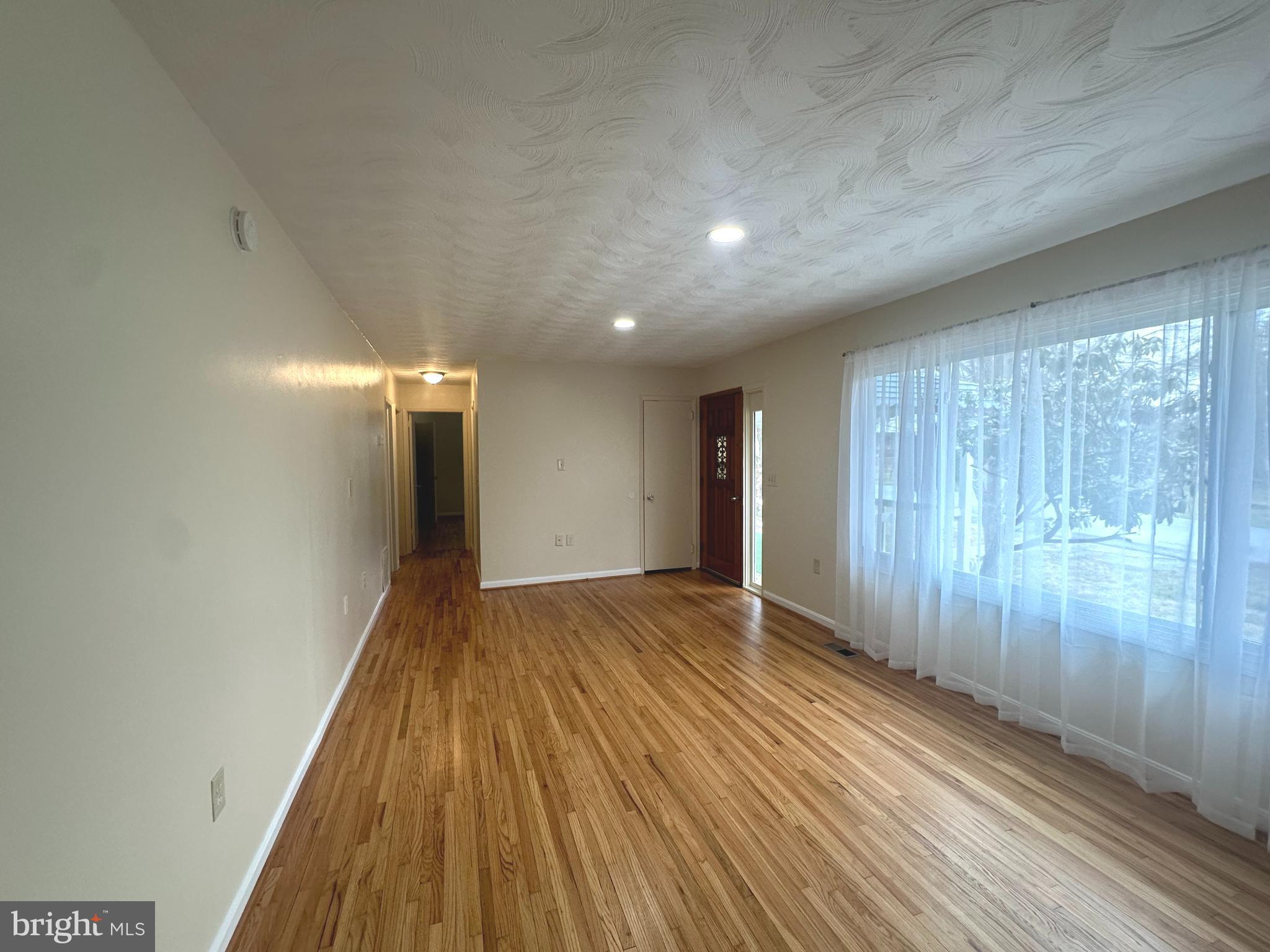 814 North Reymann Street Ranson, WV 25438 - Photo 10 of 19 a view of hallway with wooden floor