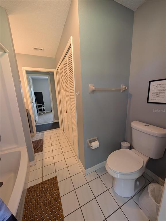 1675 Judith Drive, Unit A Kissimmee, FL 34758 - Photo 13 of 24 a bathroom with a toilet and a shower
