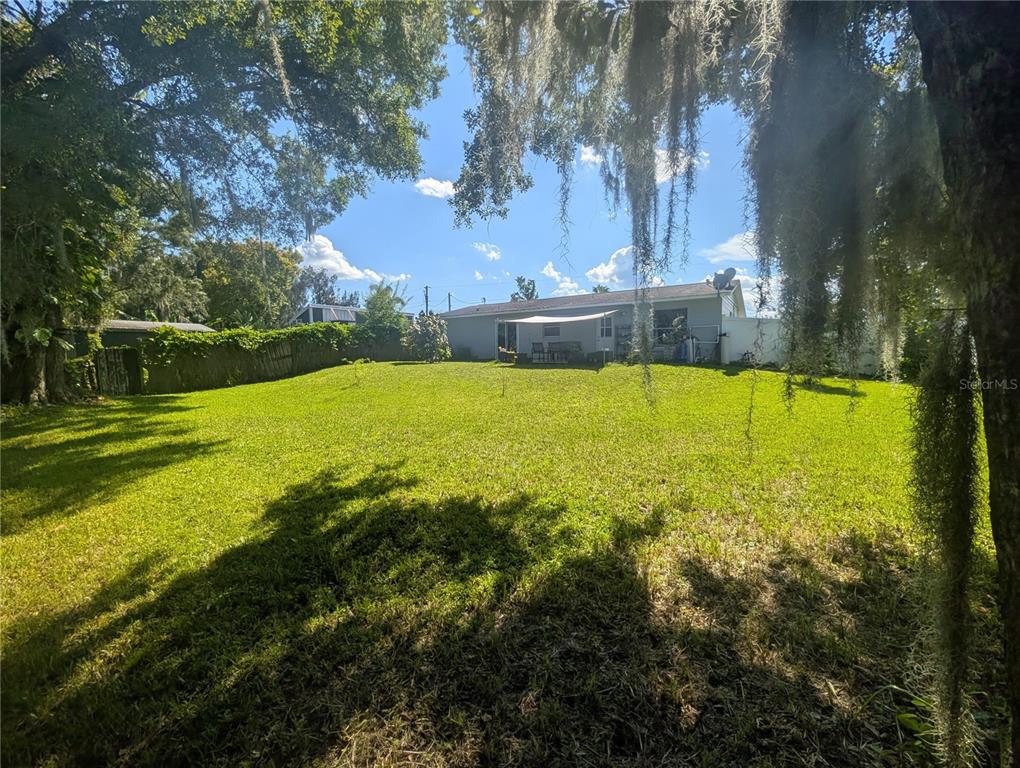 1675 Judith Drive, Unit A Kissimmee, FL 34758 - Photo 2 of 24 a view of an outdoor space and swimming pool