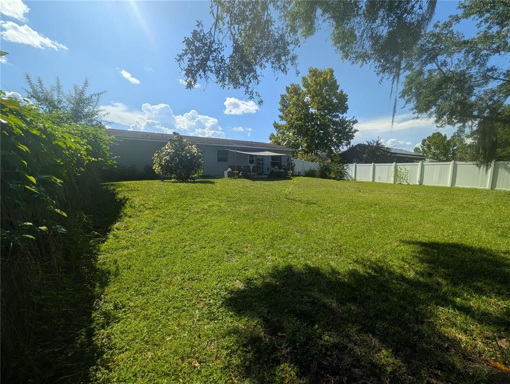 1675 Judith Drive, Unit A Kissimmee, FL 34758 - Photo 21 of 24 a view of an outdoor space and a yard